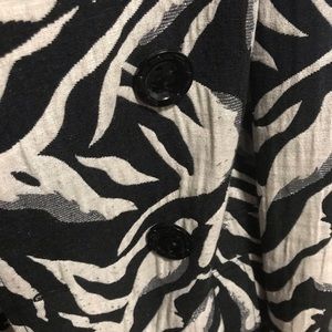 Zebra print jacket with pink inside.